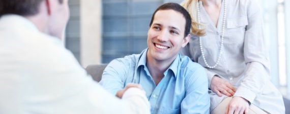 smiling-man-shaking-hand